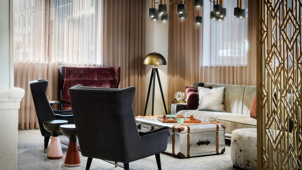 A living room with a couch and chairs.