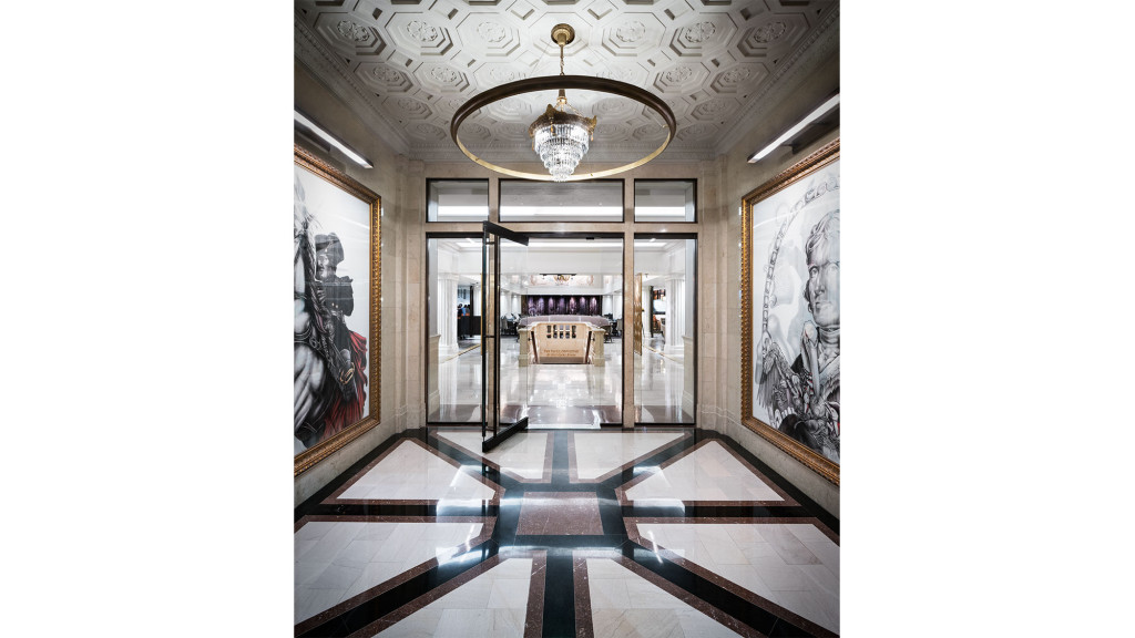 A hallway with art on the walls.