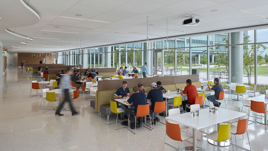 A group of people sitting at tables.