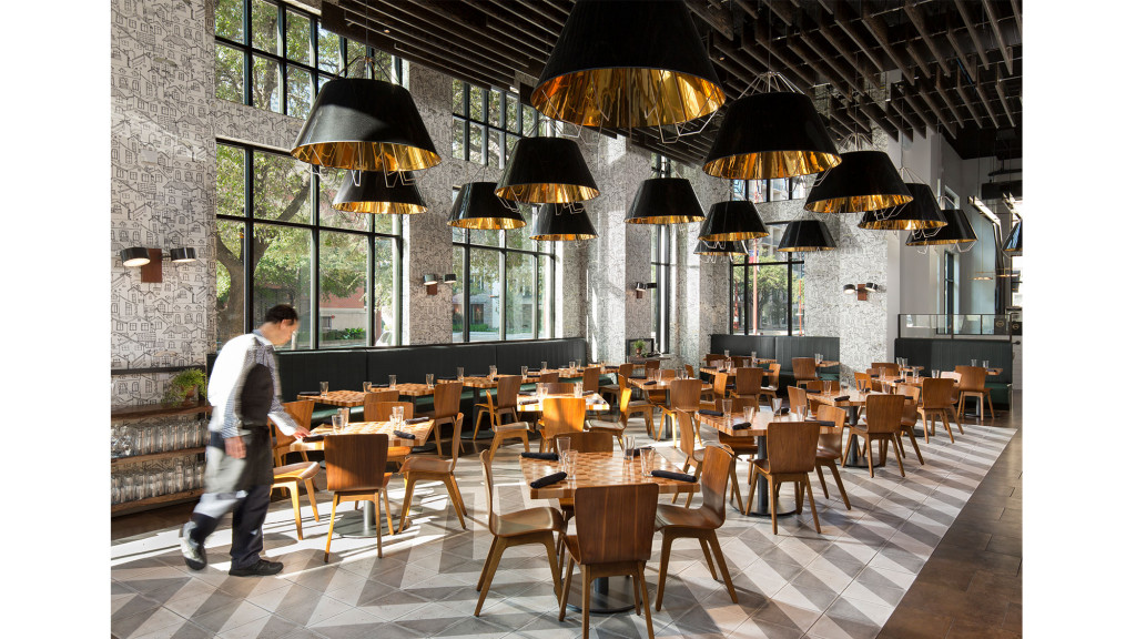 A person walking by a restaurant.