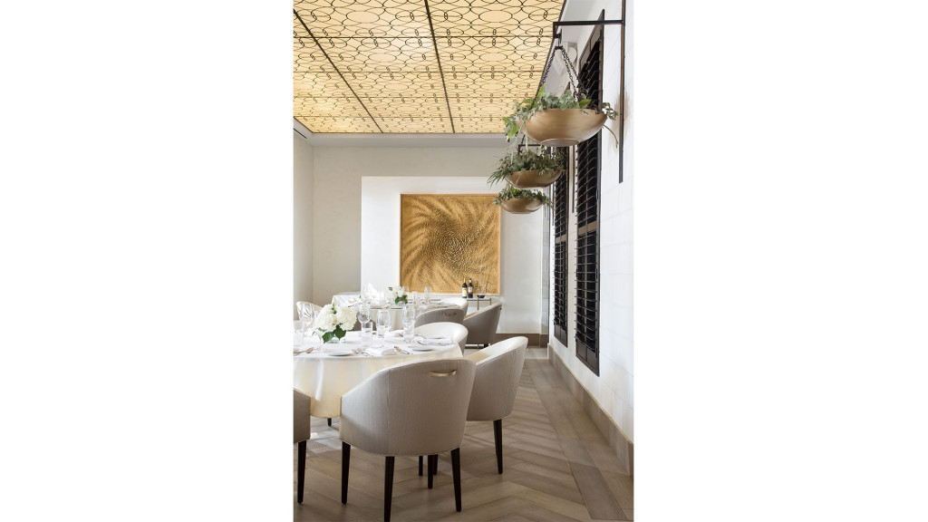 A room with a table and chairs.