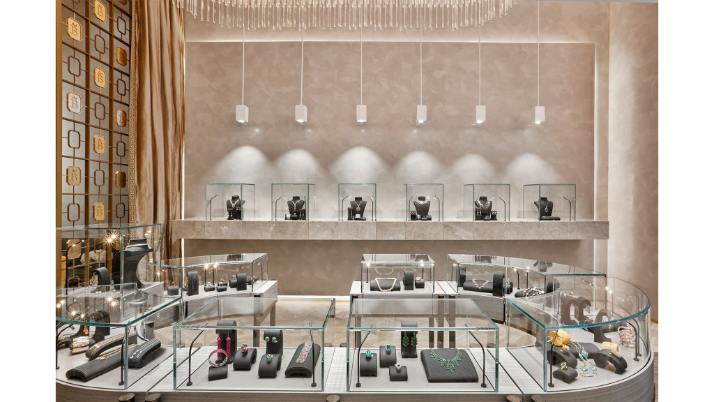 A room with a glass wall and a large mirror.