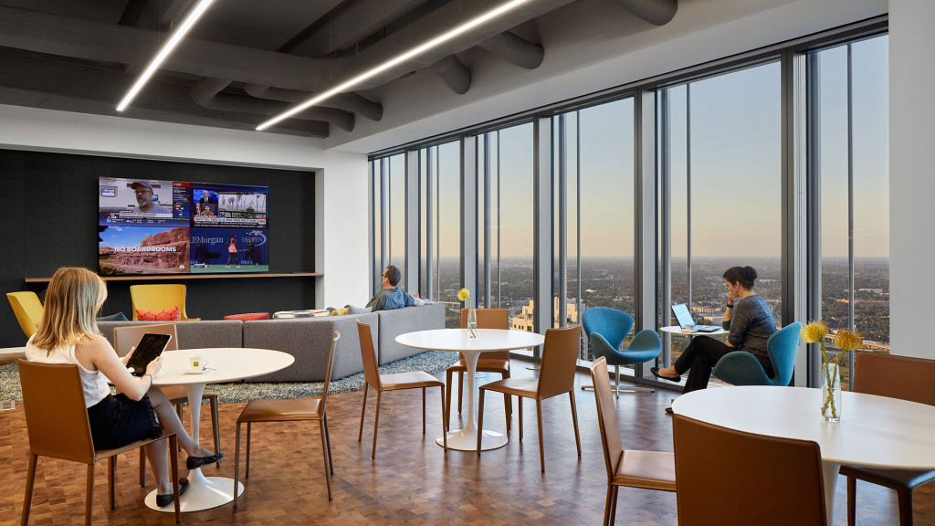 People sitting at tables in a room.