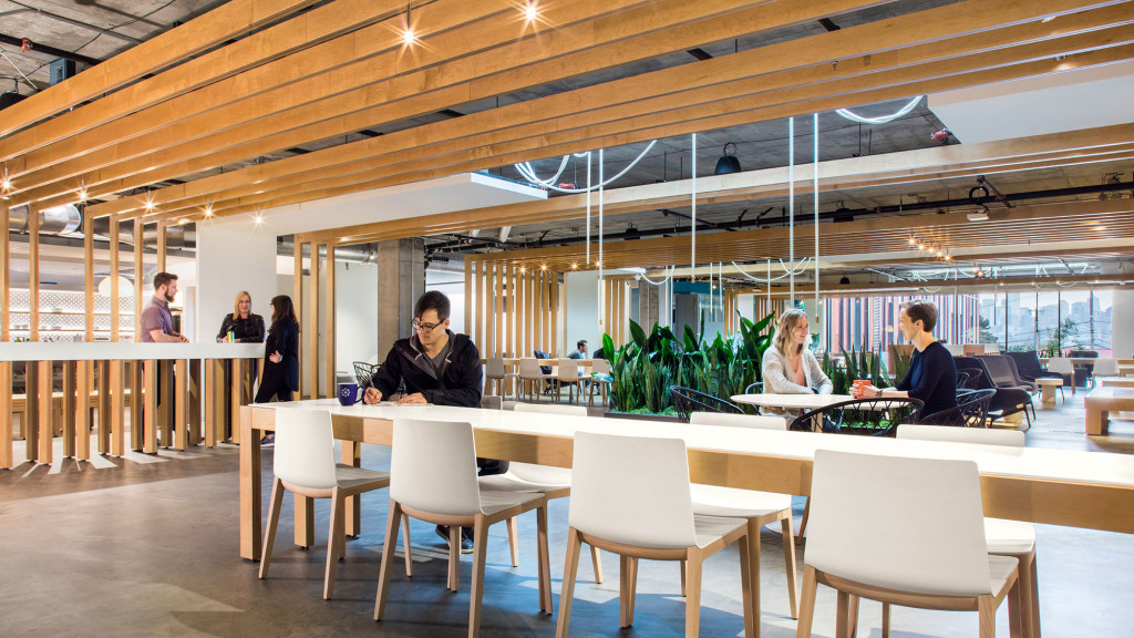 A group of people sitting at tables.