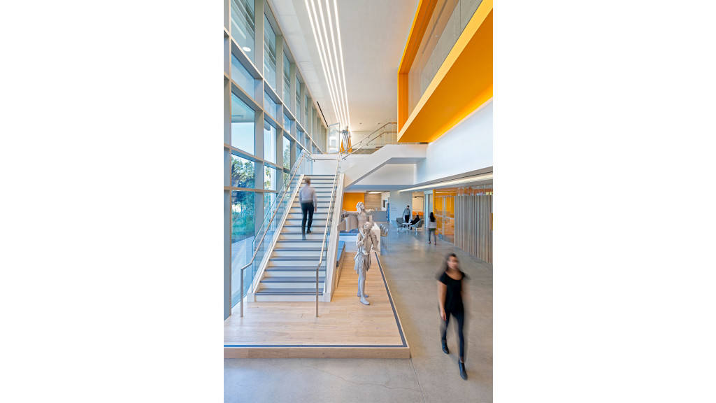 People walking down a walkway.