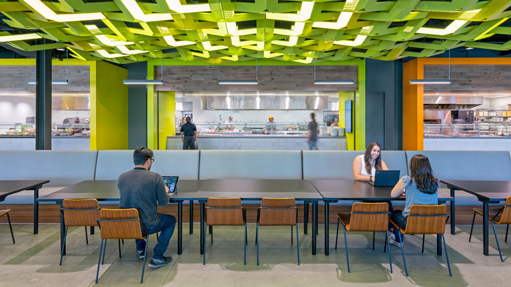 People sitting at tables in a room.