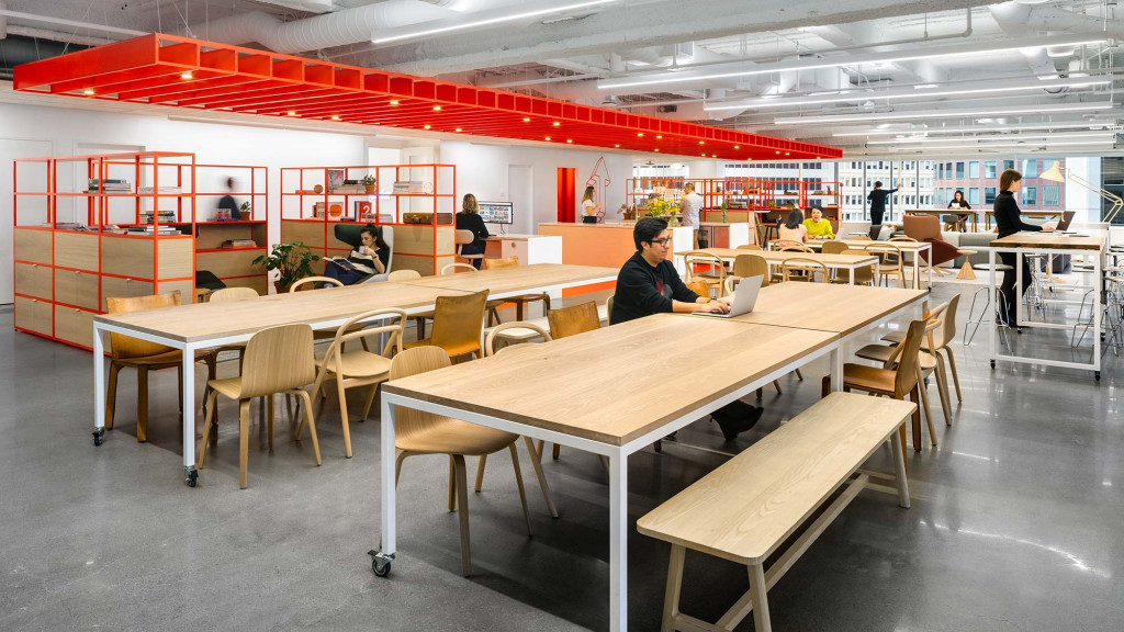 A room with tables and chairs.