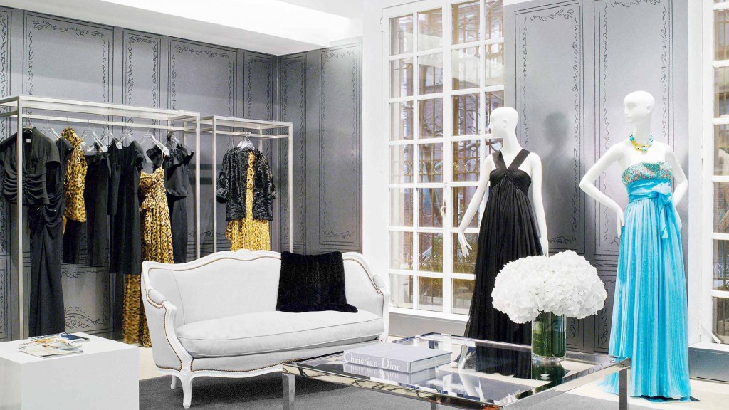 A room with mannequins and a couch.