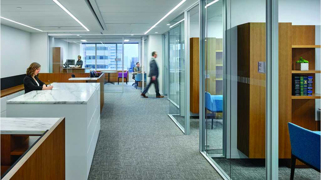 A few people in an office.