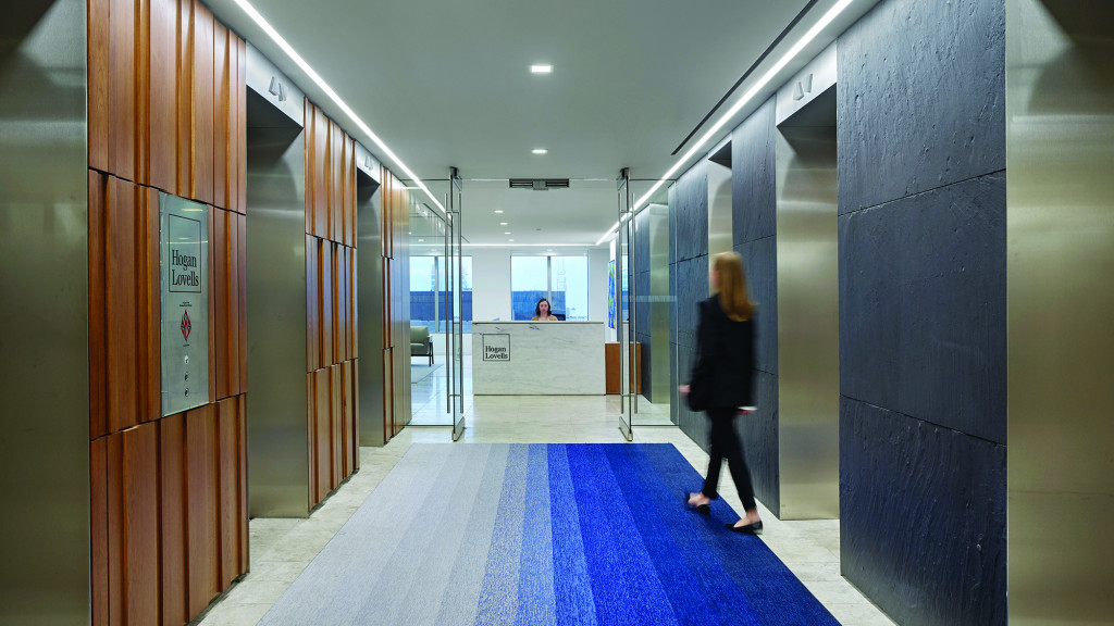 A person walking down a hallway.