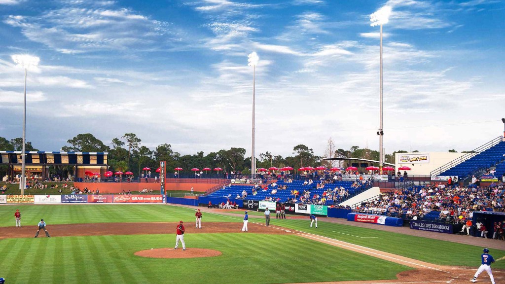 A baseball game in a stadium.