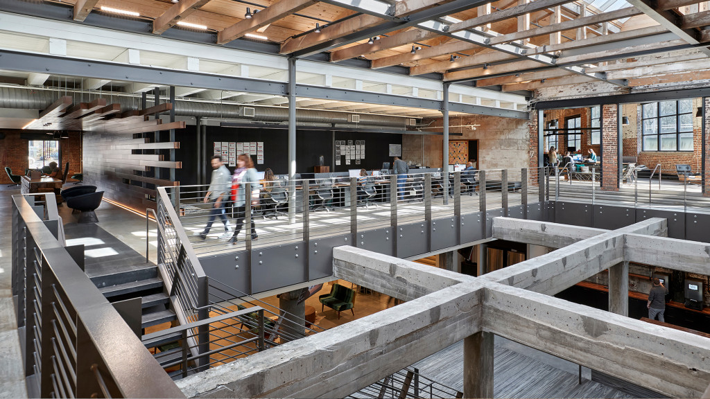 A group of people walking through a building.