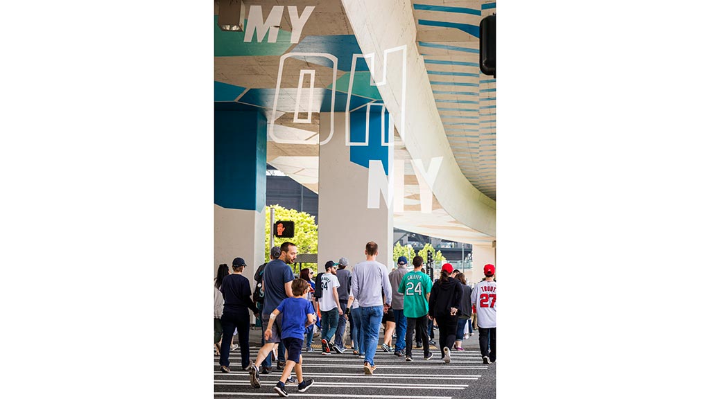 A group of people walking on a street.