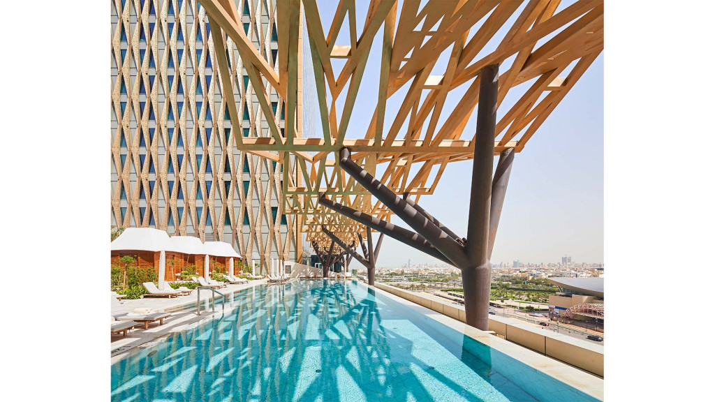 A large wooden structure over a pool.