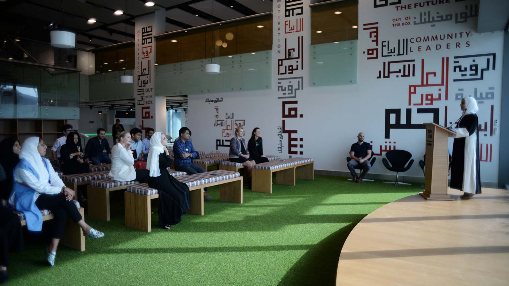 A group of people sitting in a room.