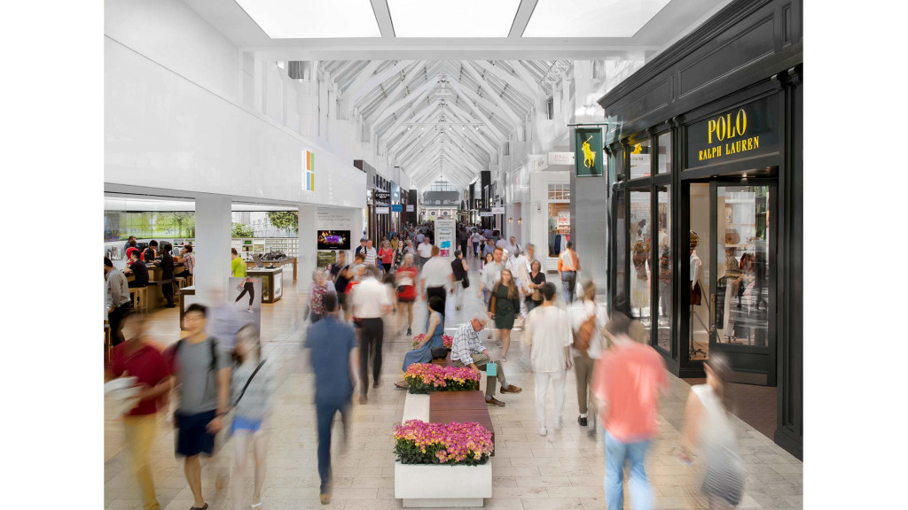 A group of people walking in a building.