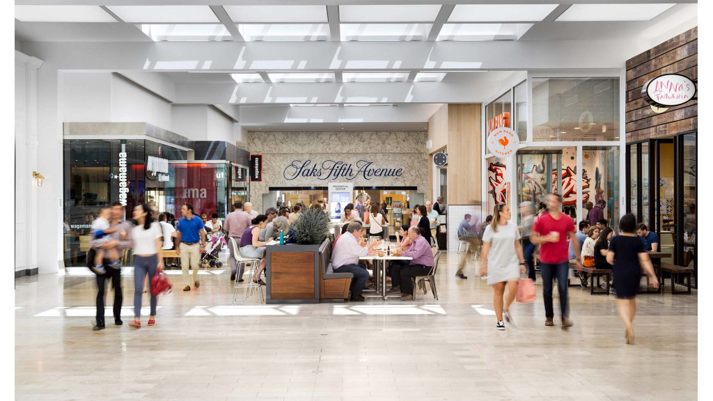 A group of people in a mall.