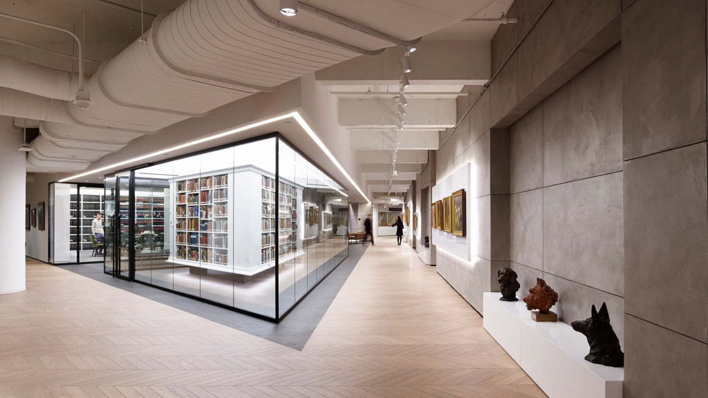 A long hallway with glass walls.