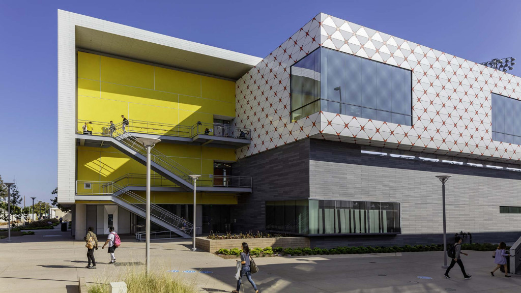 A multi-story building with people walking around.