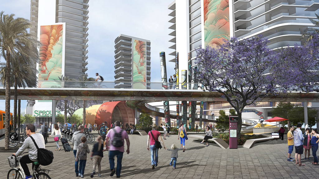 A group of people walking on a sidewalk in a city.