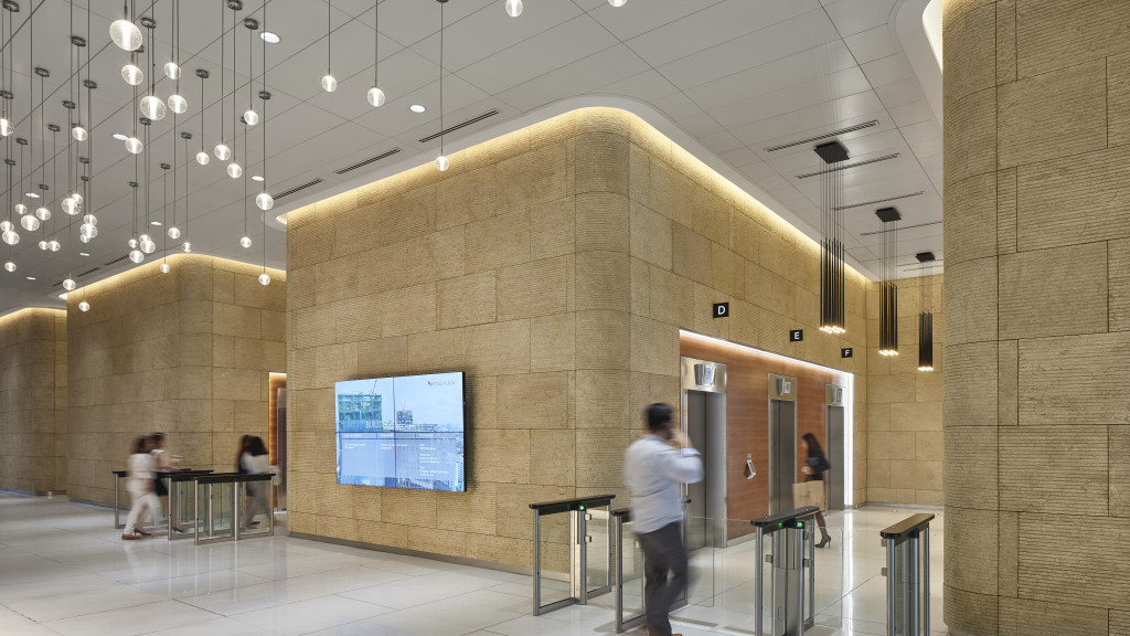 A person standing in a large room.