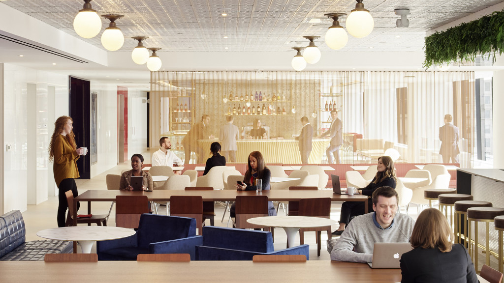 A group of people sitting around a table.