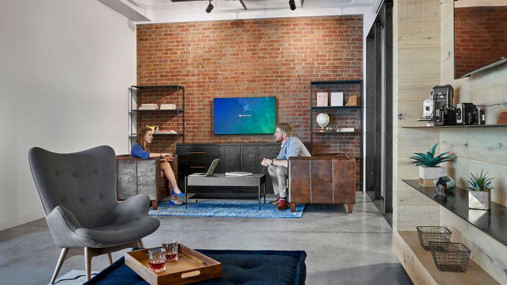 A couple of men in a room.