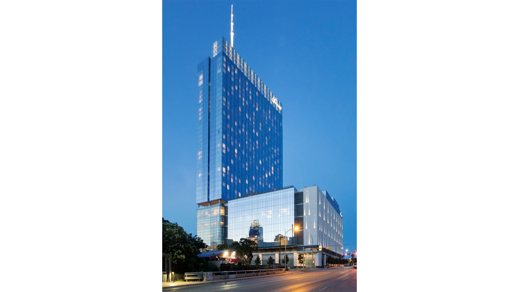 A tall building with a road in front of it.