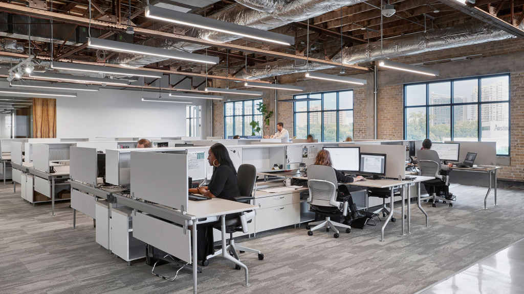 A group of people sitting at computers.