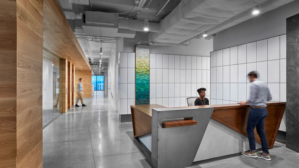 A person standing at a counter.