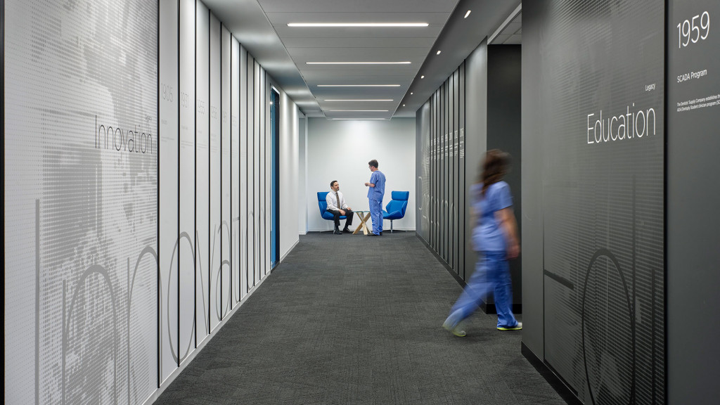 A group of people in a hallway.