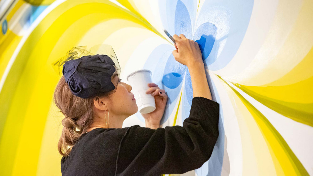 A man painting a picture.