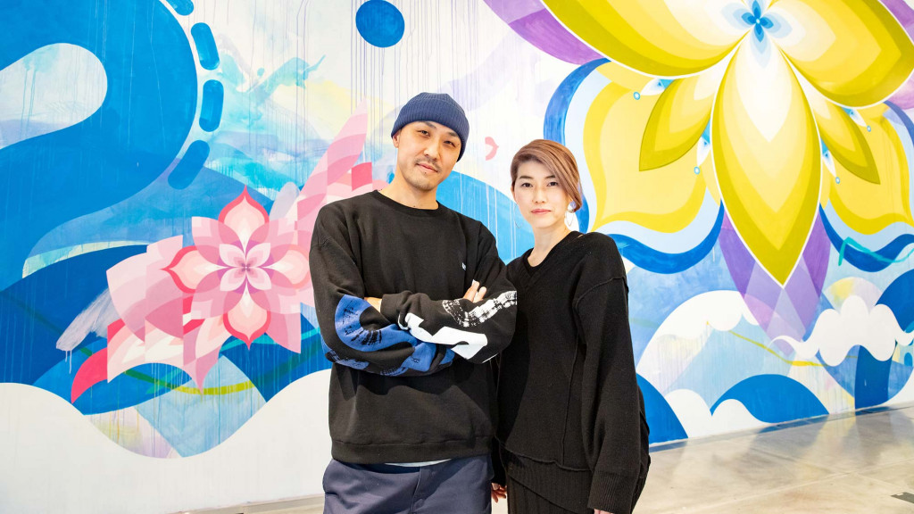 A man and woman posing for a picture.