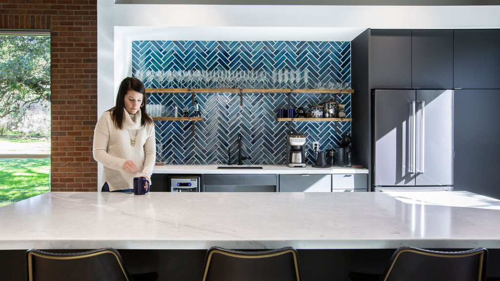 A person standing in a kitchen.