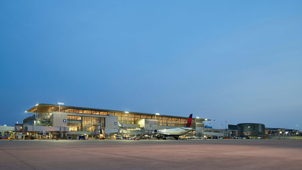 A large building with a parking lot.