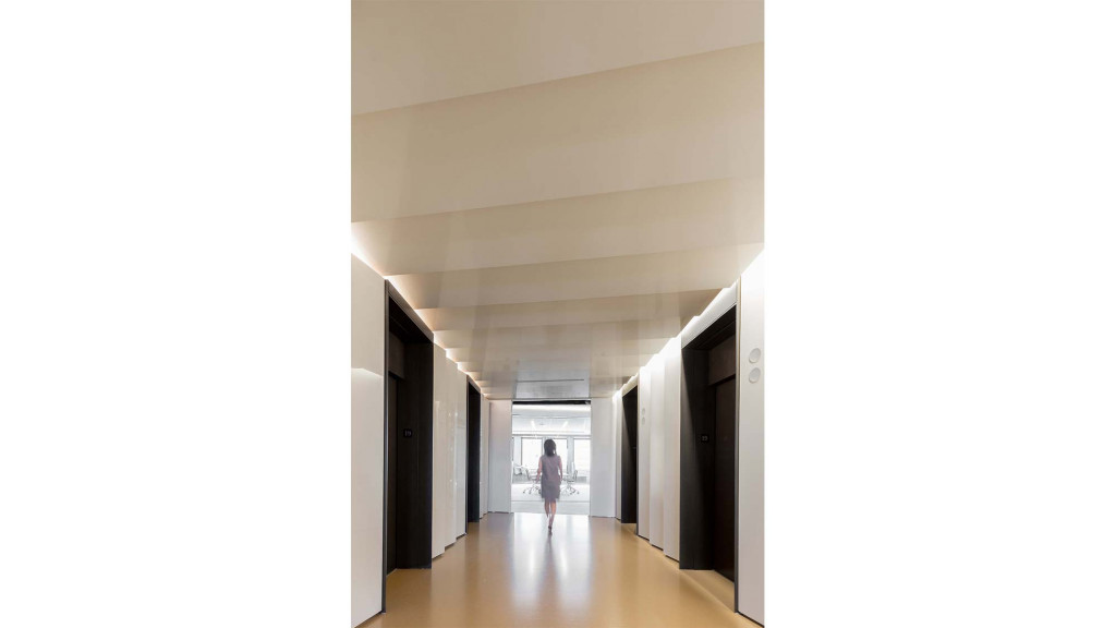 A person walking through a hallway.