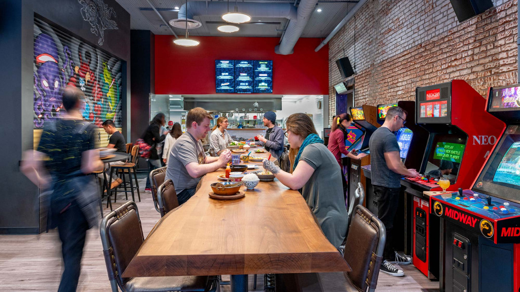 People sitting at a table in a casino.
