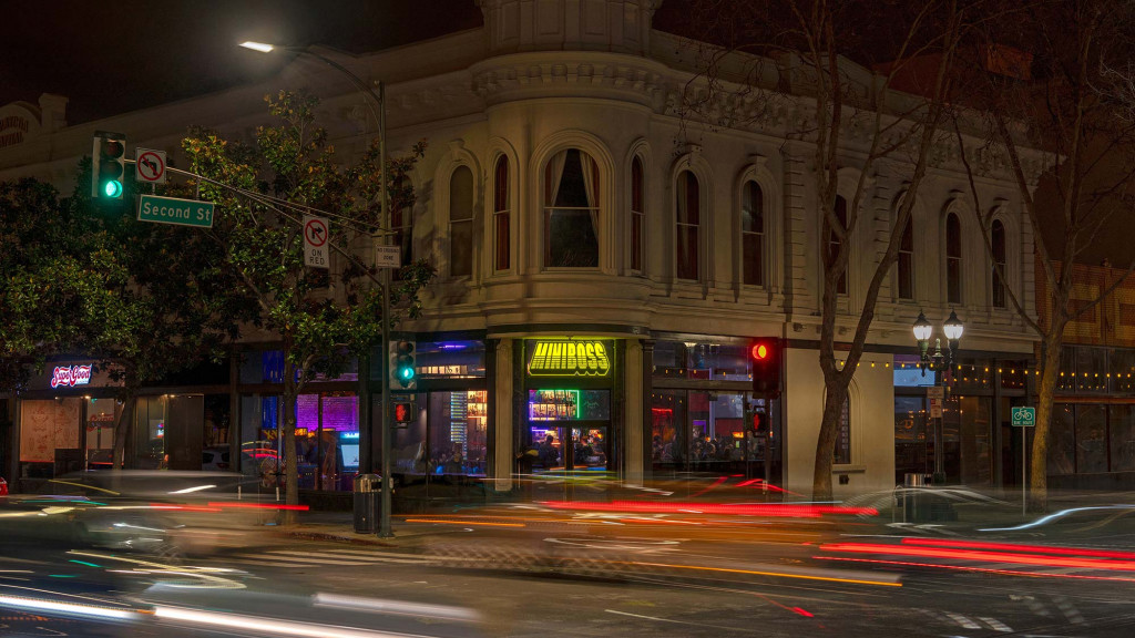A street with a building on the side.