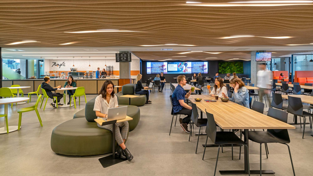 A group of people sitting at tables.