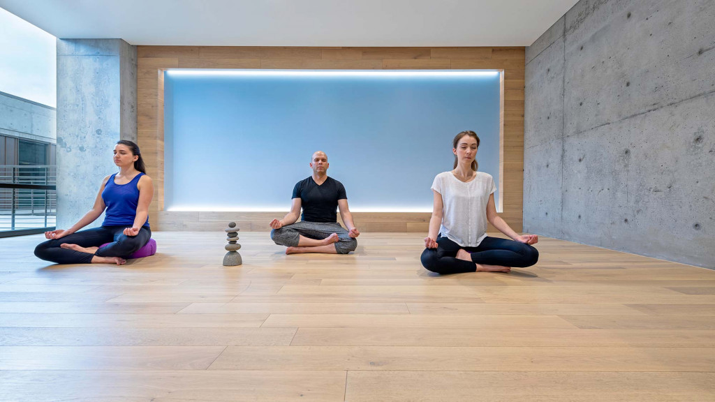 A group of people sitting on the floor.