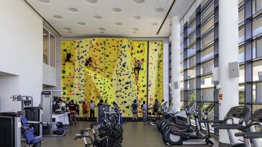 A group of people in a bike shop.