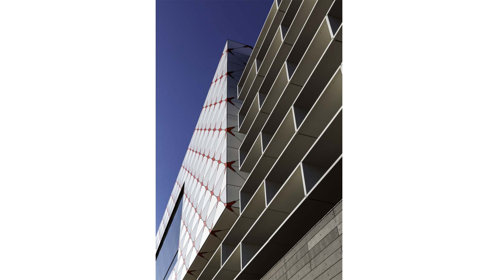 A tall building with a glass front.