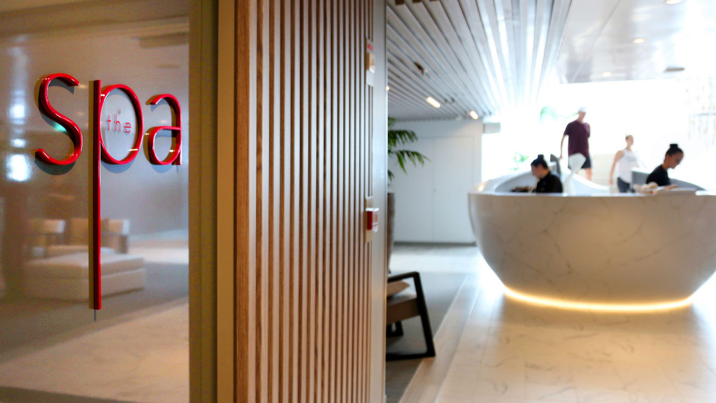A room with a bathtub and people in it.