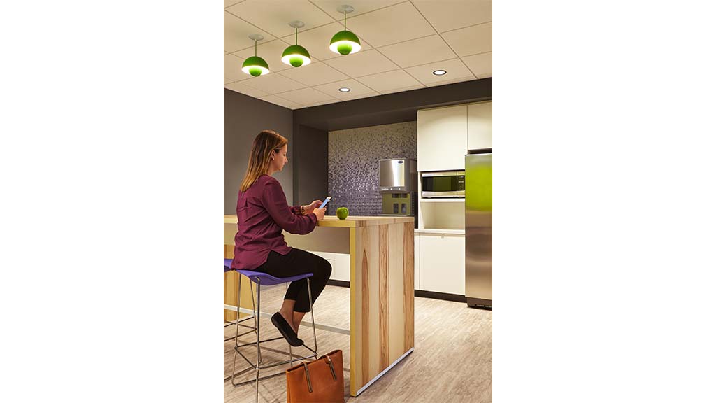 A person sitting at a counter.