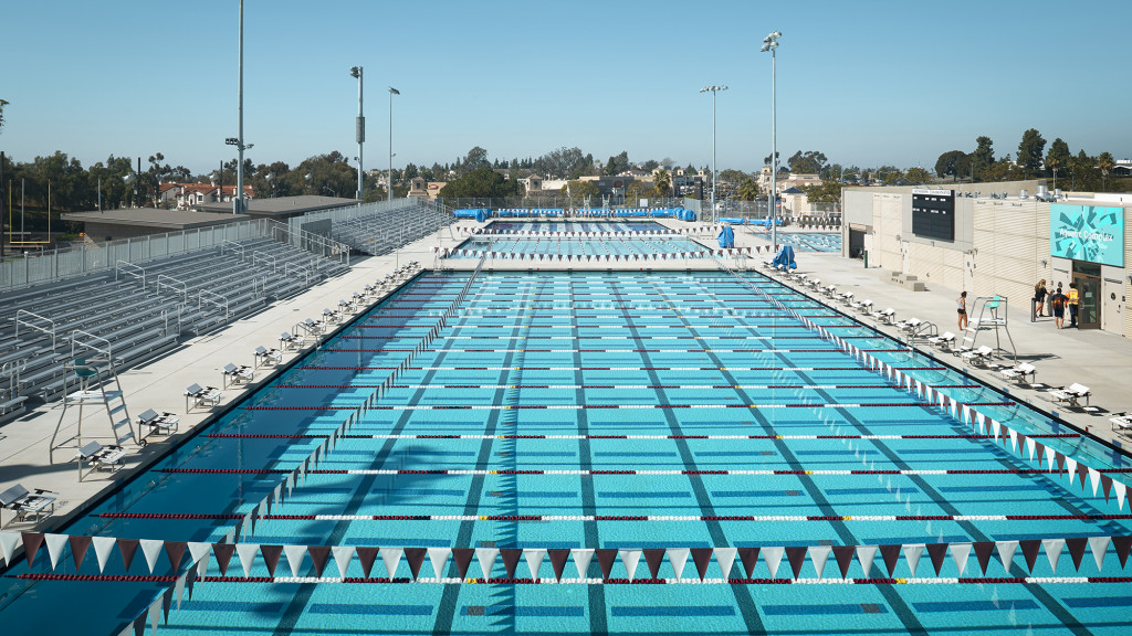 A swimming pool with a clear blue sky.