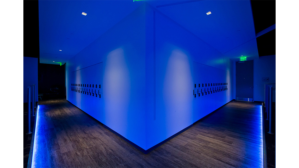 A large blue wall with a light on it.