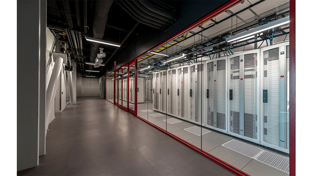 A long hallway with several computer servers.