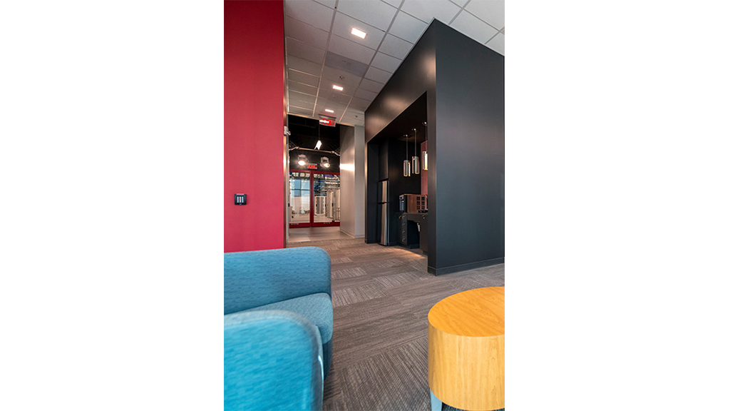 A room with a table and chairs.