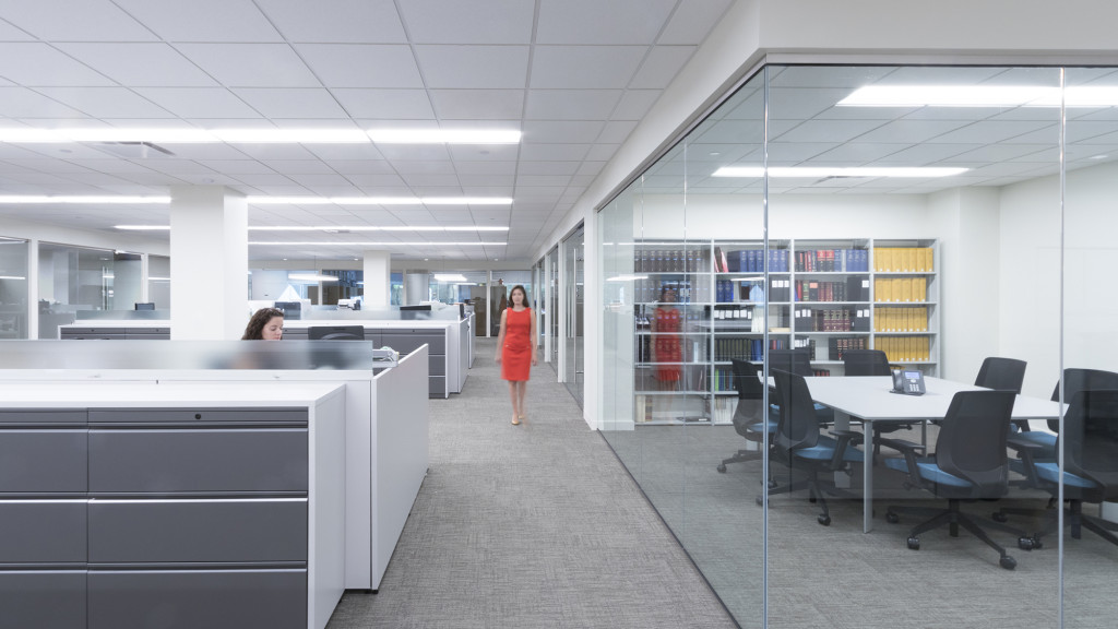 A person standing in an office.