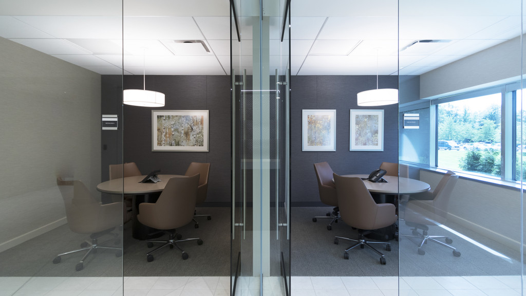 A room with a table and chairs.